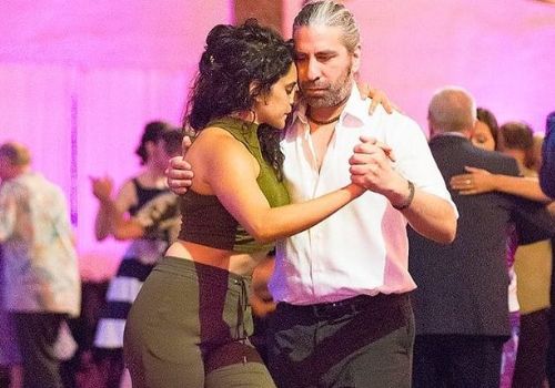 Picture of Sepideh Moafi and her dance partner Gabriel Magni dancing in a bar